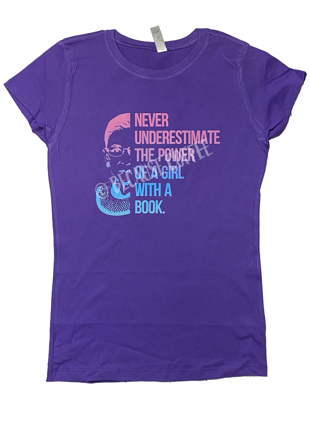 NEVER UNDERESTIMATE THE POWER OF A GIRL WITH A BOOK